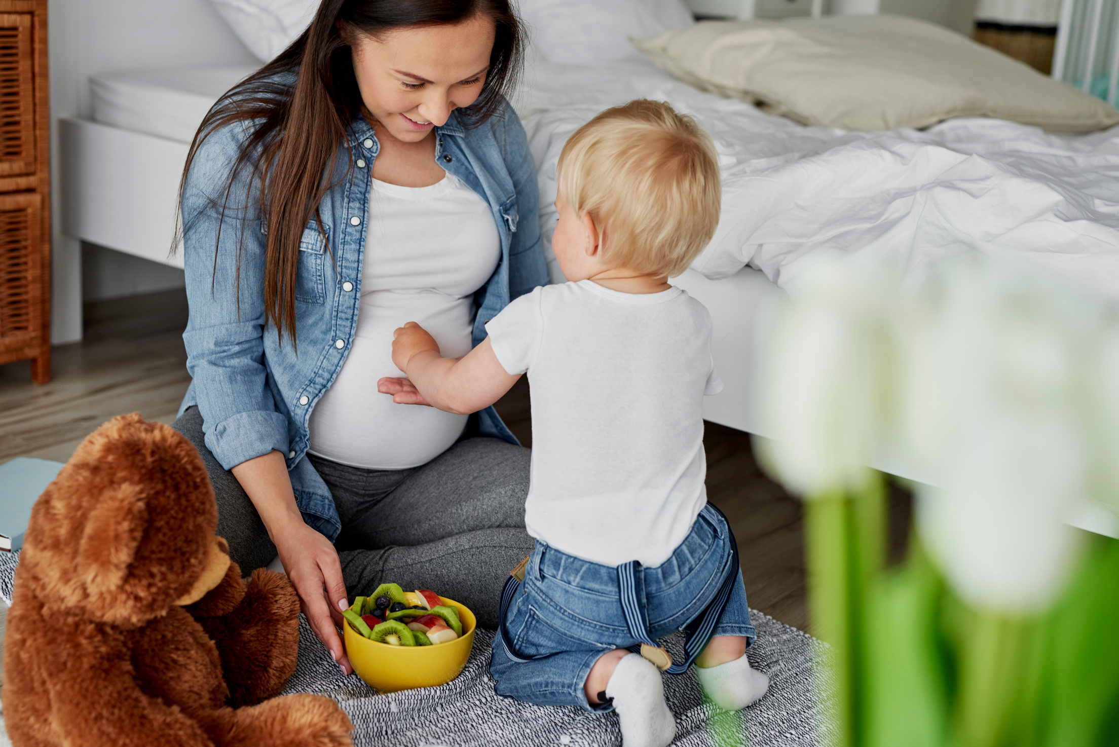 Pregnant Mom and Toddler in the Bedoom 